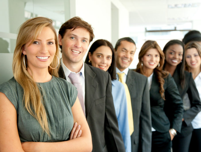 Business people group of business people smiling in an office lined up